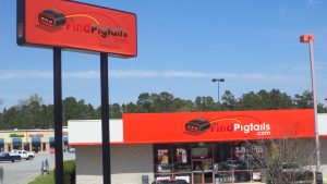 FindPigtails.com store front with red billboard and logo